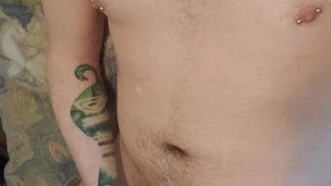 Moaning pierced puppy shoots load on himself