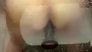 Tried banging my sissy ass into BBC dildo against the shower glass
