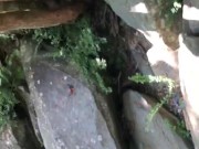 hiking wife stops outdoors to sunbath