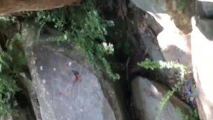 hiking wife stops outdoors to sunbath