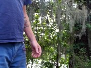 Ginger outside pissing in public park