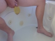 Pissing into a condom in the bathtub 6/16
