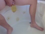 Pissing into a condom in the bathtub 8/16
