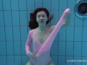 Roxalana Cheh wearing pink dress in the pool