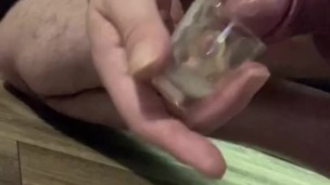 Soft cock cums in shot glass, then cum dump for more strokes