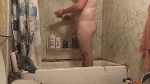 Fat guy jerks dick in shower and swallows own cum