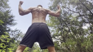 Cam Crest flexes is outside in public.