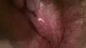 Hairy pussy playing with her fingers 