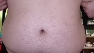 Fat guy wearing bodysuit strips and cums