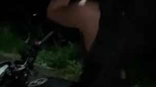Amateur biker girl at night in public
