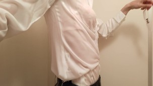 Taking a shower while crossdressing. (pink bra is seen through the blouse)