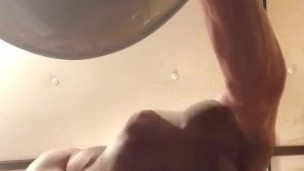 Stroking my big cock in the bathroom