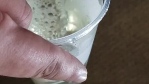 Small cock pissing into cup - urination