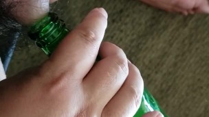 Small cock pissing into bottle - urination