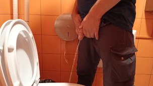 pee in a public orange toilet