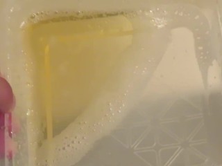 Pissing into the plastic case.