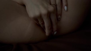 Hot bitch sexually caresses her pussy and ass with a butt plug