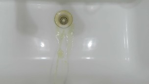 pissing in wash basin.