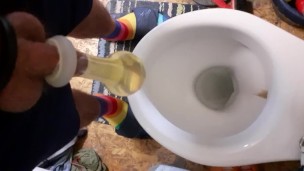 Having fun pissing in condom