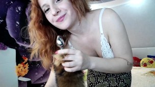 Sexy girl take off skirt and panties with sucking plug for ass