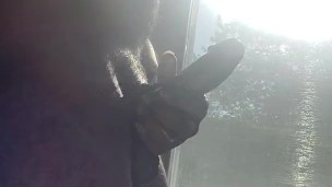 Jacking off n the window while people walk pass