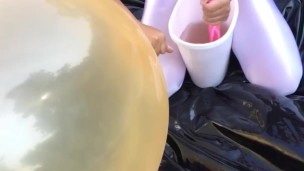 Shiny leotard balloon climb-in using gallons of slime