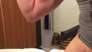 Muscle guy shoots a load of cum over his compression top.