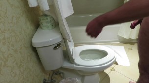 Stringy cum in hotel toilet trying to be quiet