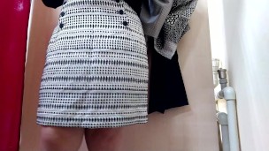 OMG! Russian mommy trying on skirts in a fitting room in a shopping mall