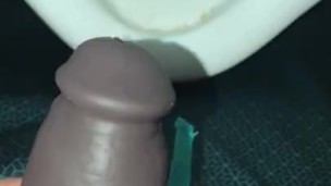 Using a hollow Cock Sleeve Packer Device to go Pee into a Urinal for the first time