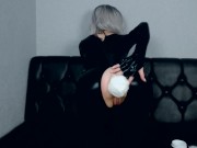 skinny blonde in black latex tries on different anal plugs