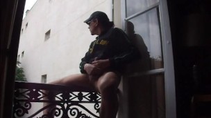 wanking on balcony