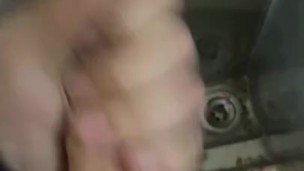 Twink cruises and jerks at urinal