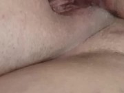Playing with a glass dildo