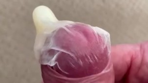 Jerking a load in condom