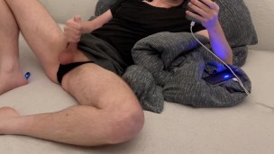 Crossdresser cumshot on stomach while wearing skirt and thong. 