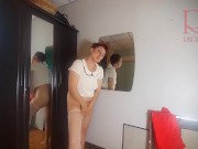 A naked lady does make-up in front of a mirror, puts on underwear, stockings, a skirt. 2 15/16