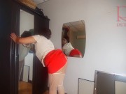 A naked lady does make-up in front of a mirror, puts on underwear, stockings, a skirt. 3 14/16
