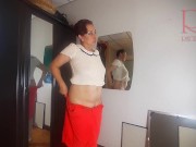 A naked lady does make-up in front of a mirror, puts on underwear, stockings, a skirt. 3 3/16