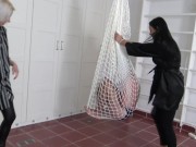 Madame Carla and Amber hang their slaves in a net in the room and kick them together heartily from all sides. 12/16