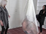 Madame Carla and Amber hang their slaves in a net in the room and kick them together heartily from all sides. 6/16