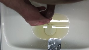 Pissing into the sink and into the foreskin