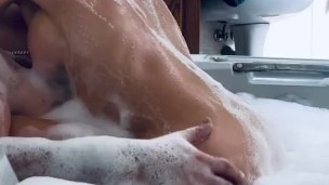 Dirty milf gets covered in bubbles and soaped up to fuck