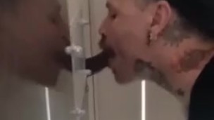 Sucking BBC at a gloryhole