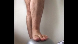 Super squishy gym ball under my big male feet tiny ball makes my feet feel enormous - MANLYFOOT