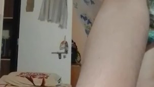 Nude crossdresser femboy in girl's top only.