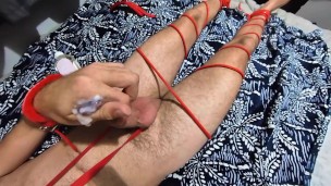 Tied gagged guy cums on himself