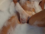 Busty blonde teen masturbates in the bath