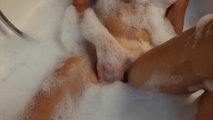Busty blonde teen masturbates in the bath