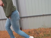pissing with a powerful stream on the street by the fence 4K 16/16